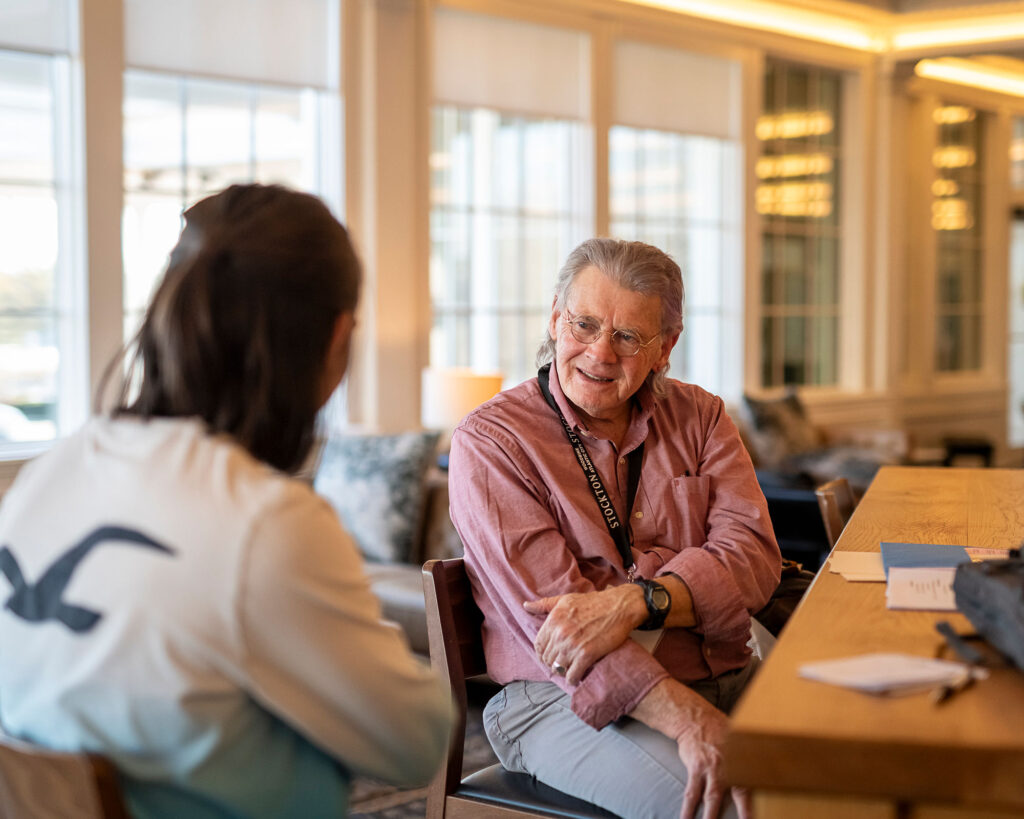 Peter talking to a writer